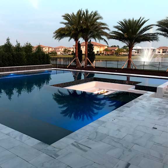  linear pool design with sunken seating fire pit